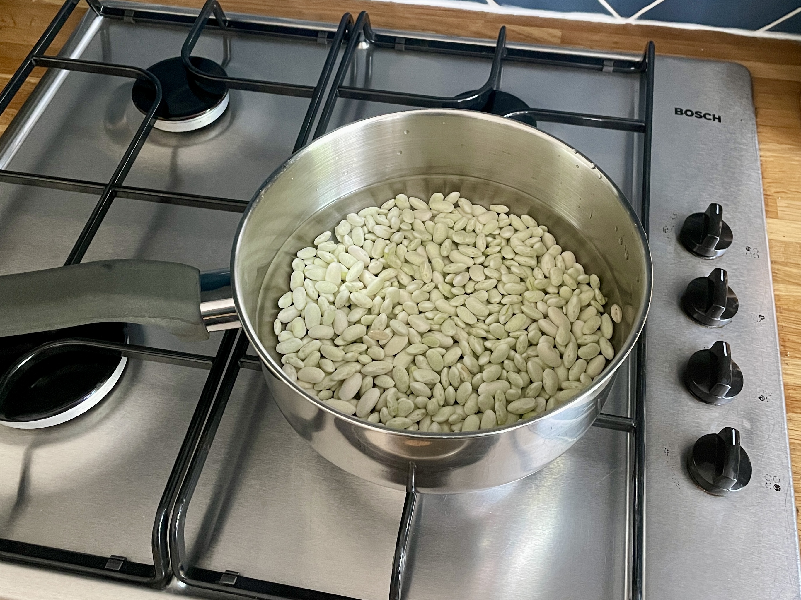 Boiling the beans from purple French beans before using in pasta dish